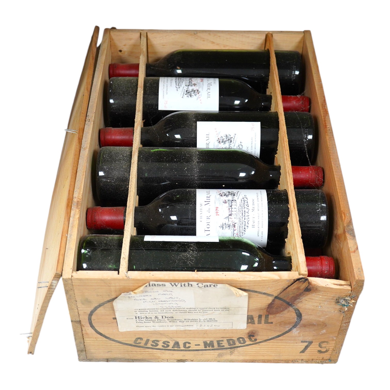 A wooden case of twelve bottles of La Tour du Mirail 1979 Haut Medoc red wine. Condition - fair to good, storage history unknown